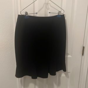 Knee length skirt with skirt flare and detail.